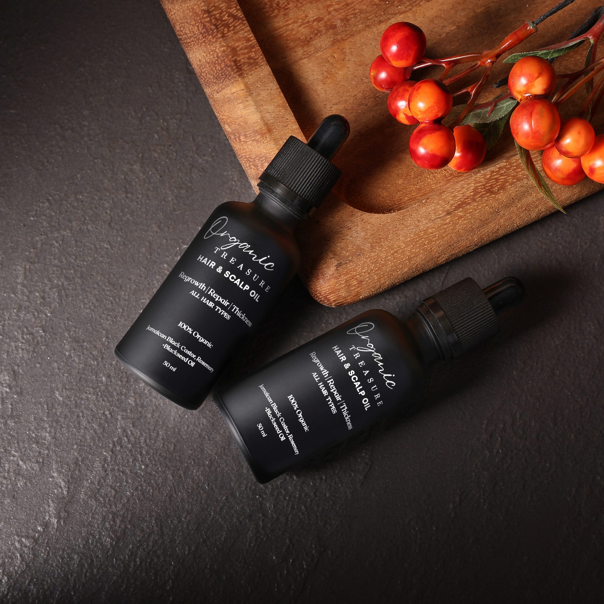 Applying Organic Hair Growth Oil to scalp as part of hair care routine